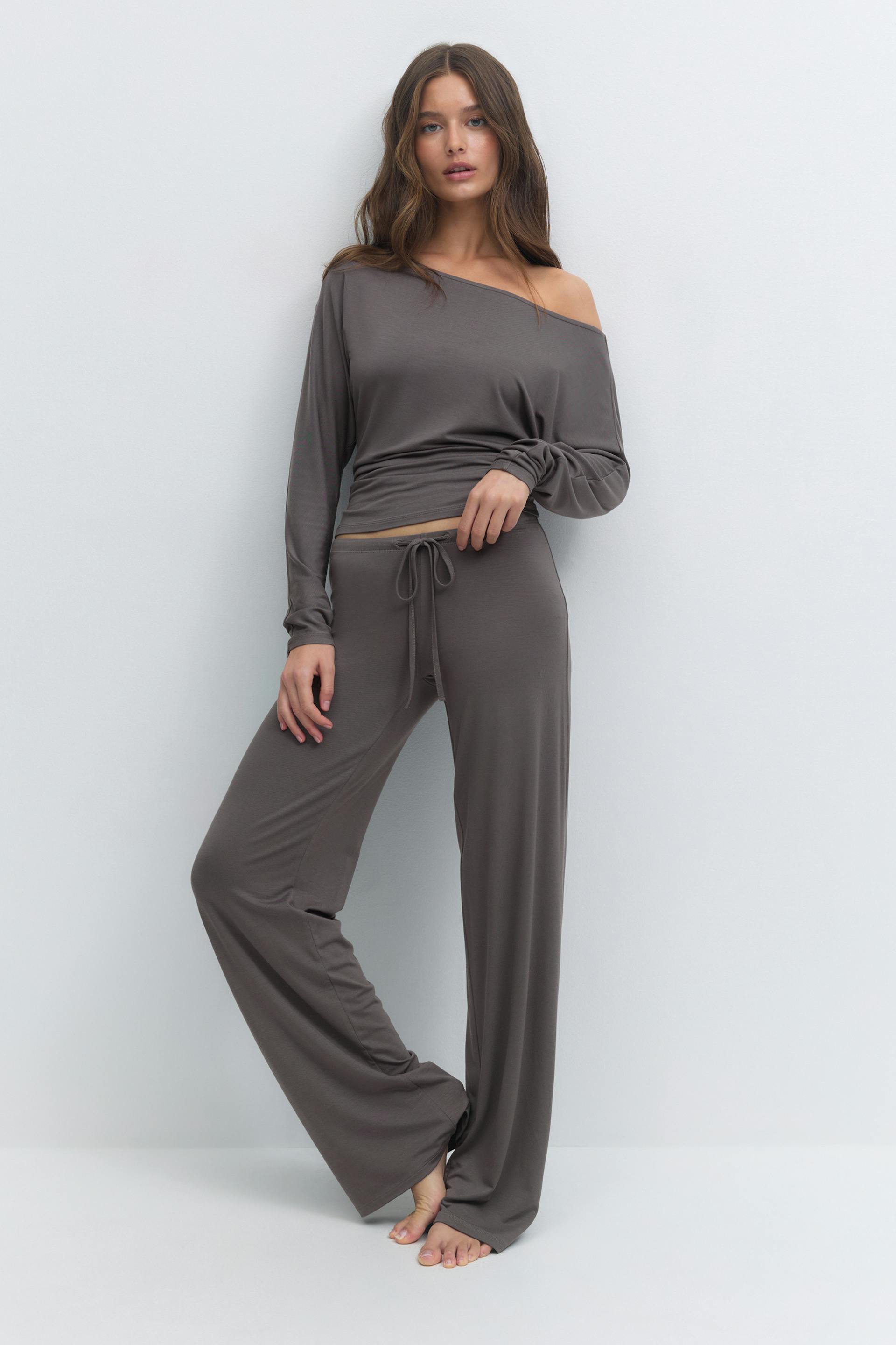 Off-the-shoulder long-sleeve top paired with matching drawstring wide-leg lounge pants in muted taupe.