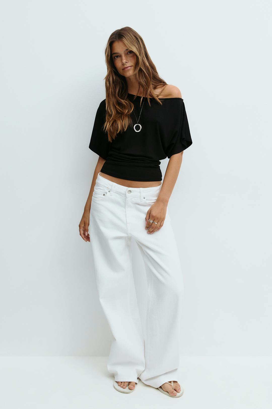 Sloped shoulder top