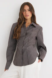 Shoulder pad shaped shirt