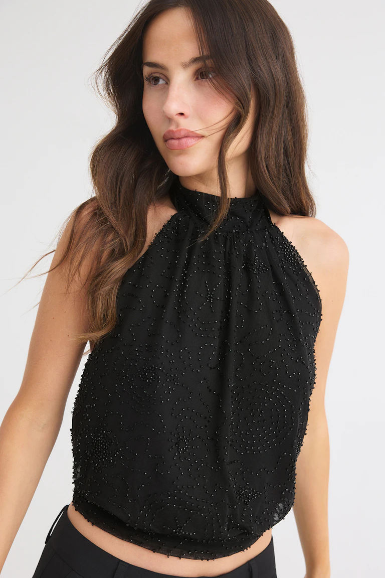 329720 / 13146: Black halterneck top with beaded detailing.