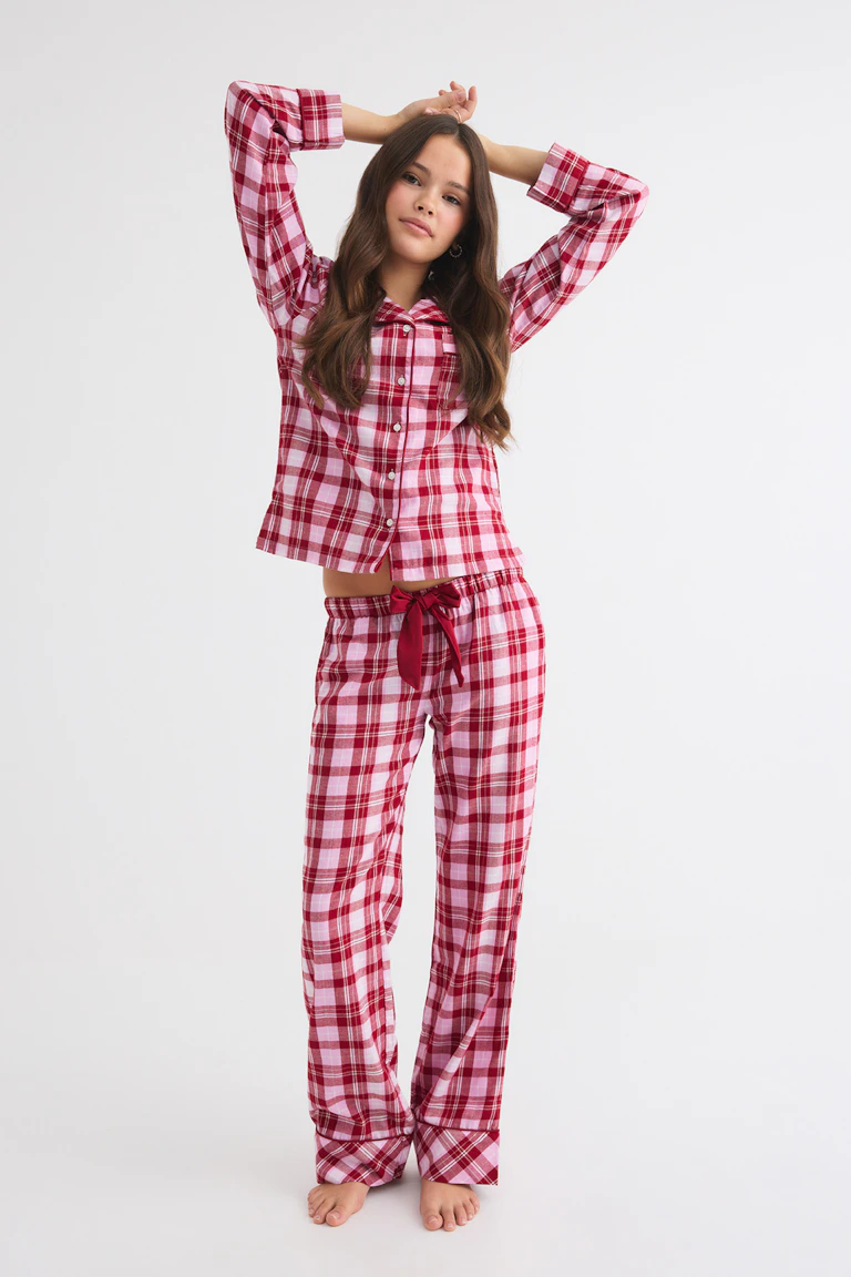 Pink and red plaid pajama set with a button-up shirt and wide-leg pants.